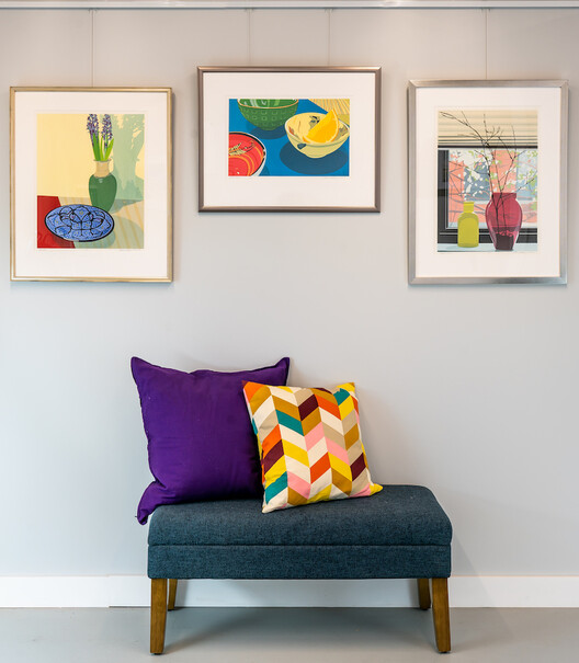 Three Prints Hung on Picture Hanging System for Art Display