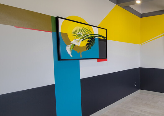 Office conference room with bold painting on wall