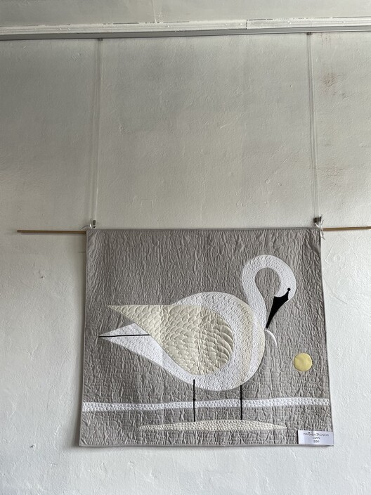 Handmade quilt with image of swan displayed using the Gallery System picture hangiung