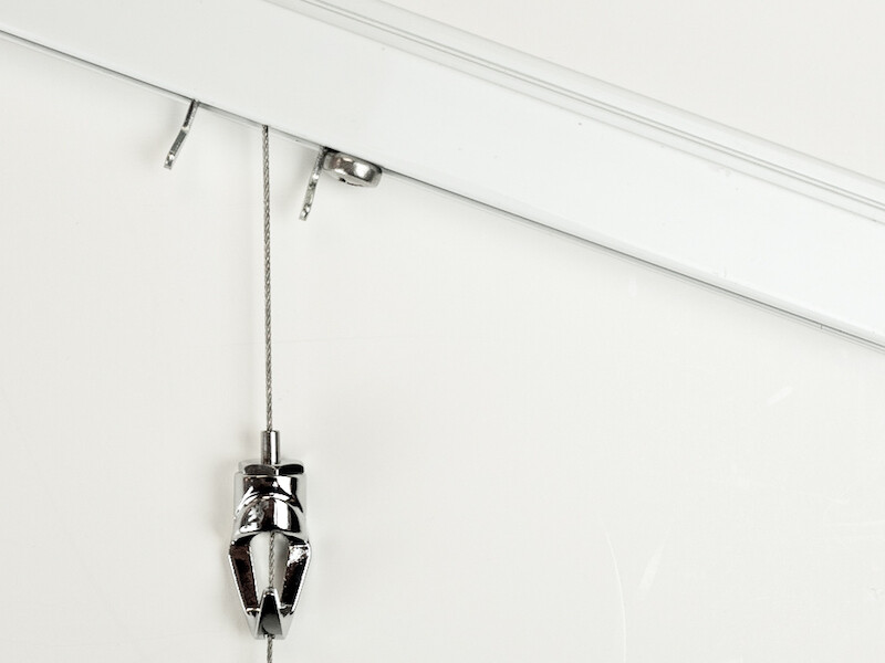 Picture Hanging System mounted at an angle, with bolt serving as stop to keep hanger in position
