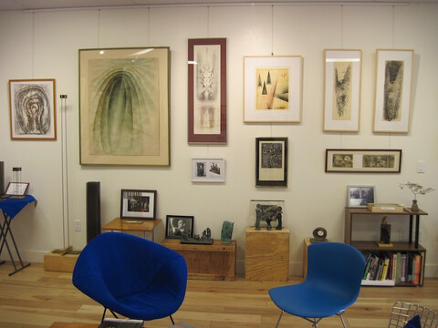 full view of room in Harry Bertoia Foundation Gallery, showing furniture, sculpture, and art by Harry Bertoia and picture hanging system
