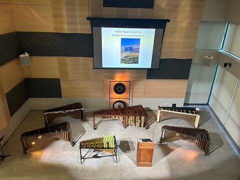 Aerial view of music performance space with multiple mallet percussion instruments